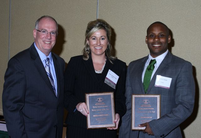 ISBA President John E. Thies presents Young Lawyer of the Year Awards to Angela Baker Evans of Peoria and Steven Hunter of Chicago.