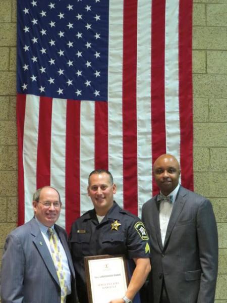 Sergeant Joel Marquez (center), of the Downers Grove Police Department, received a 2014 Law Enforcement Award from the ISBA on June 18 in Wheaton. On hand for the presentation were Robert J. Anderson (far left), a circuit judge in the 18th Judicial Circuit Court who nominated him for the award, and Vincent F. Cornelius, second vice president of the ISBA, who presented the award.