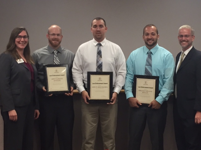 Illinois State Bar Association Board Treasurer Angelica W. Wawrzynek (far left) and Perry County Assistant State’s Attorney David Searby (far right) presented an ISBA Law Enforcement Award to Perry County Sheriff Deputies Jeremy Gothard, Reid Bastien, and Sergeant William Reagan on Sept. 26 at Pinckneyville City Hall.