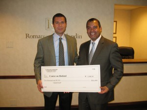Illinois Bar Foundation Grants Committee Member Tony Romanucci presents a $5,000 grant to Modesto Tico Valle, Executive Director for the Center on Halsted.