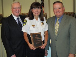 Western Springs Police Chief Pamela Church (center) received the 2009 Law Enforcement Award from the Illinois State Bar Association (ISBA) Monday evening, June 8, during a ceremony at the Western Springs village hall. ISBA President-elect John G. O’Brien (left) and Russell W. Hartigan, a Chicago attorney and ISBA board member who resides in Western Springs, presented the award.