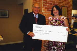 IBF Board member and ISBA 1st Vice President Mark Hassakis of Mt. Vernon presents a $2,500 check to Mariah Hayes, Executive Director of CASA of Franklin County. 