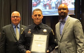 Illinois State Bar Association President Vincent F. Cornelius (far right) and 2nd Vice President James F. McCluskey (far left) presented an ISBA Law Enforcement Award to Naperville Police Officer Shaun Ferguson on Sept. 20 at Naperville City Hall.